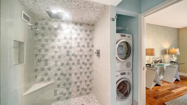 a view of bathroom with washer and dryer