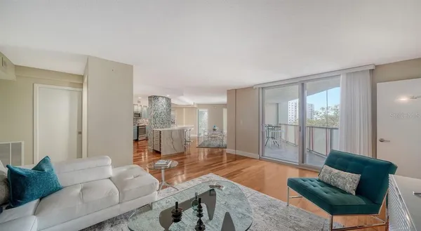 a living room with furniture and a window