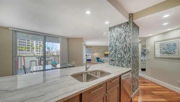 a kitchen with a sink and large window