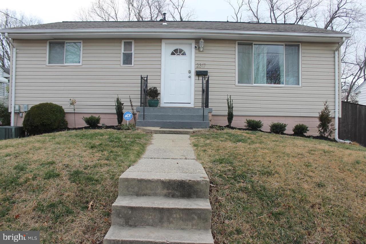2317 Roslyn Avenue District Heights, MD 20747 - Photo 1 of 1 a front view of a house with garden