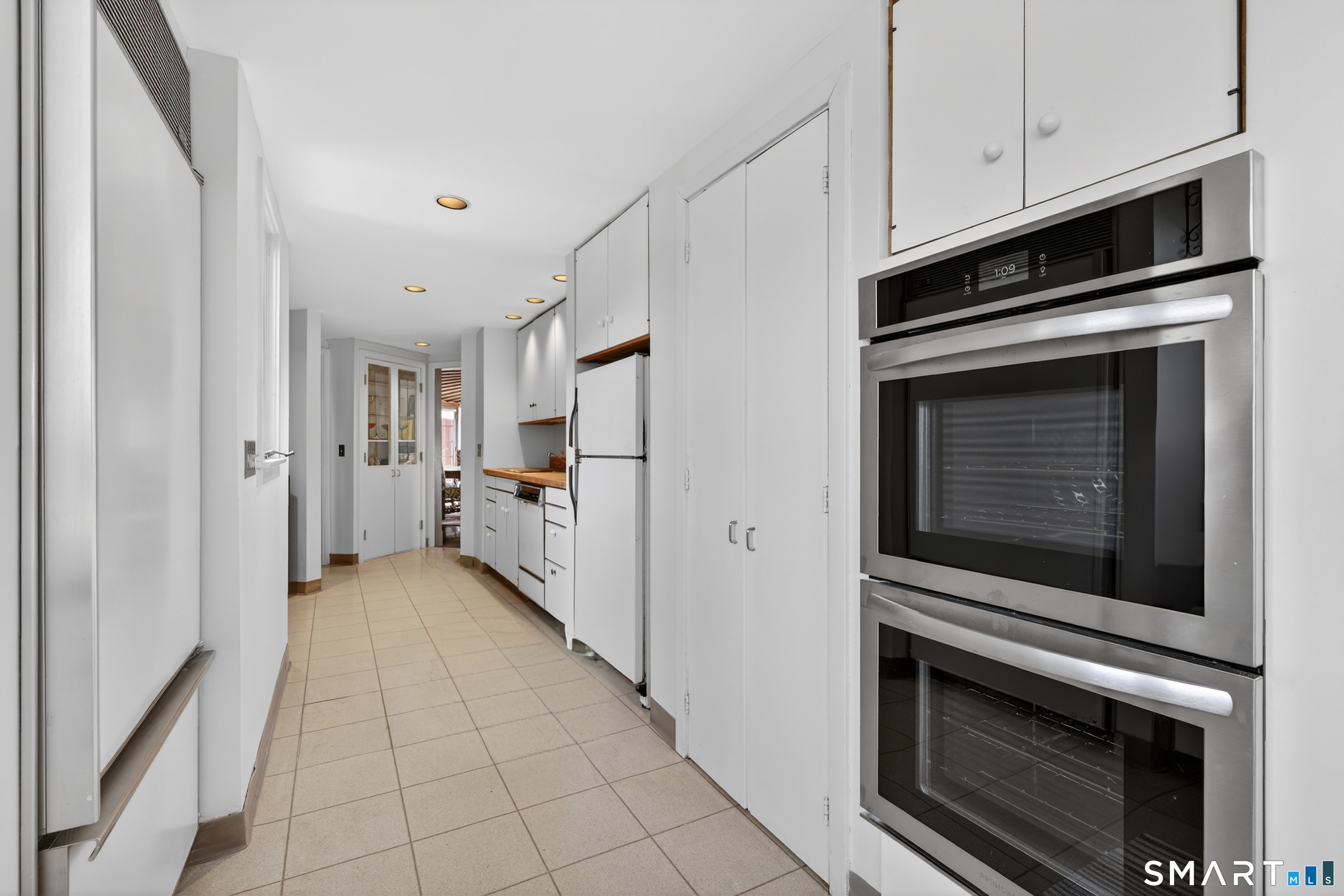 39 Vineyard Place Guilford, CT 06437 - Photo 12 of 41 a kitchen with cabinets and stainless steel appliances