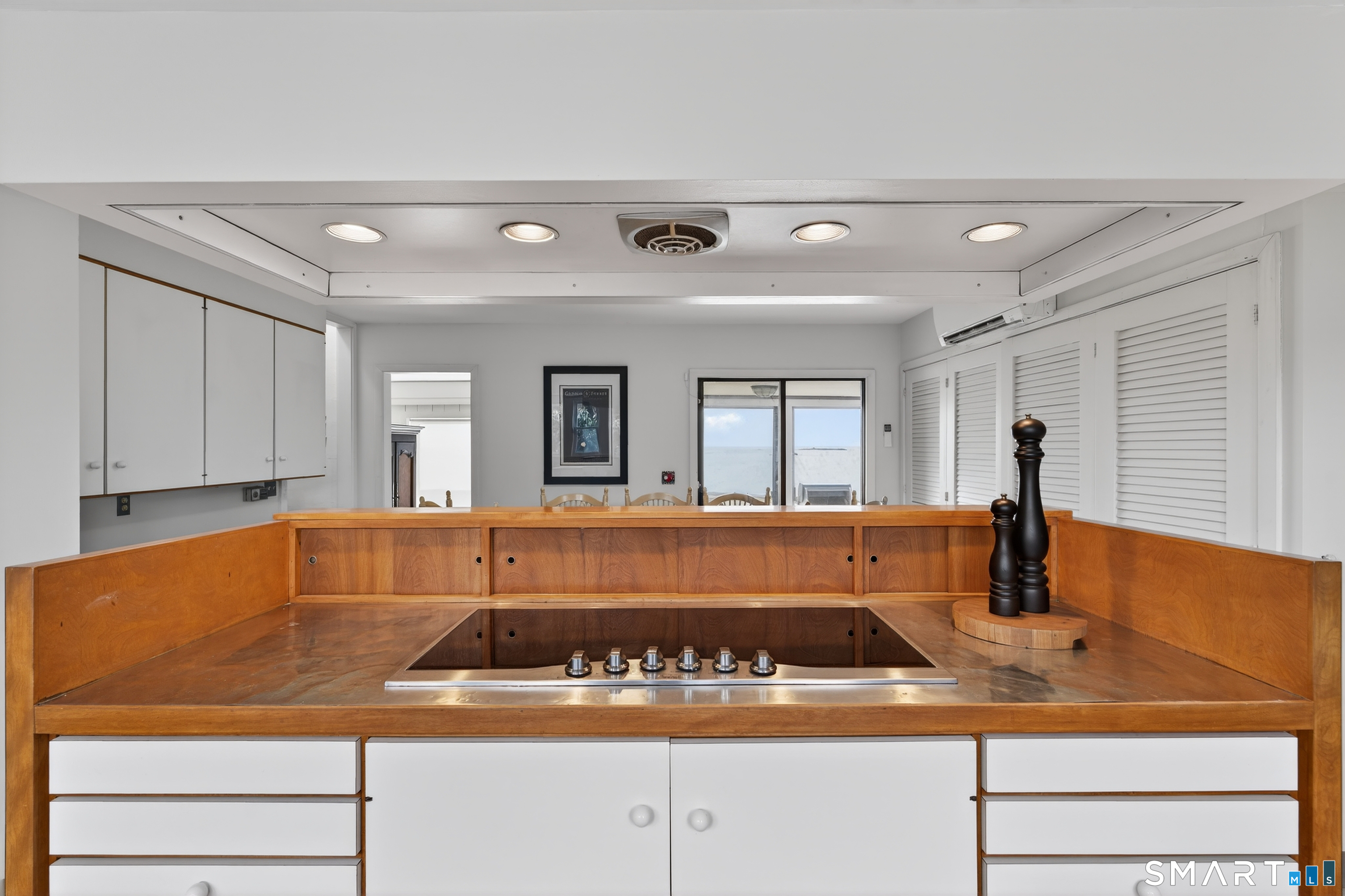 39 Vineyard Place Guilford, CT 06437 - Photo 15 of 41 a kitchen with a sink and white cabinets