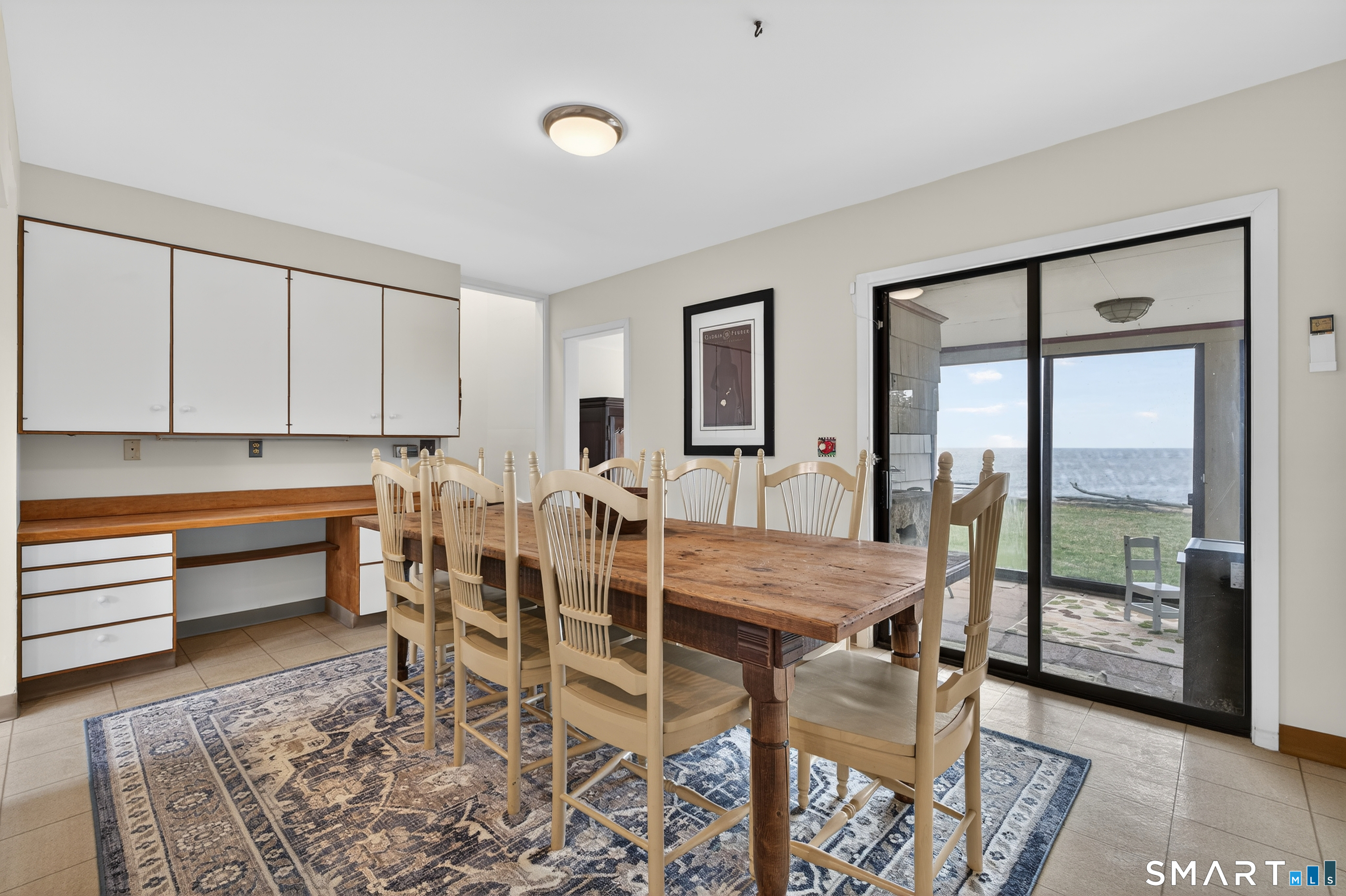 39 Vineyard Place Guilford, CT 06437 - Photo 16 of 41 a view of a dining room with furniture and window