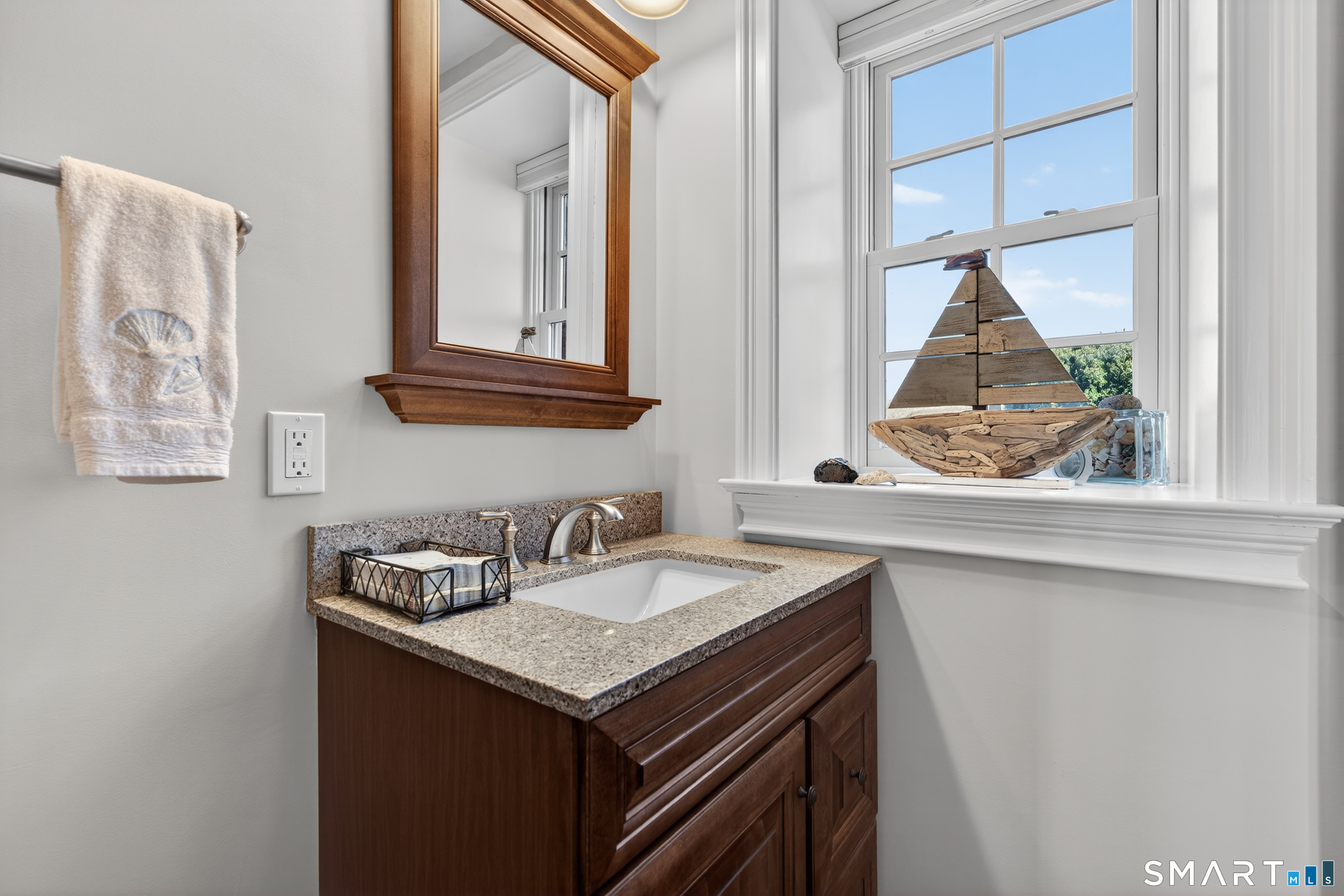 39 Vineyard Place Guilford, CT 06437 - Photo 20 of 41 a bathroom with a sink and a window