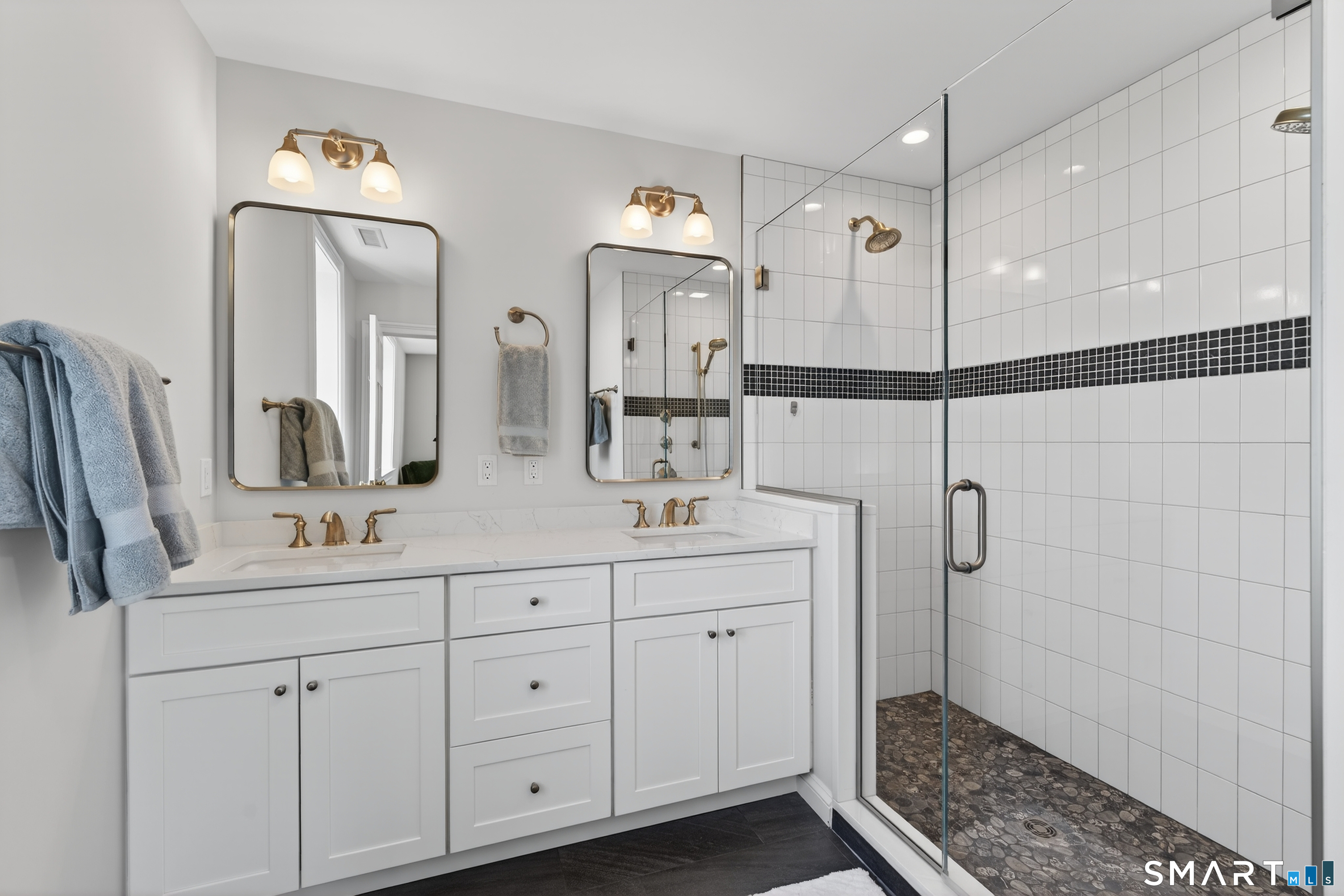 39 Vineyard Place Guilford, CT 06437 - Photo 22 of 41 a bathroom with double sink and a mirror