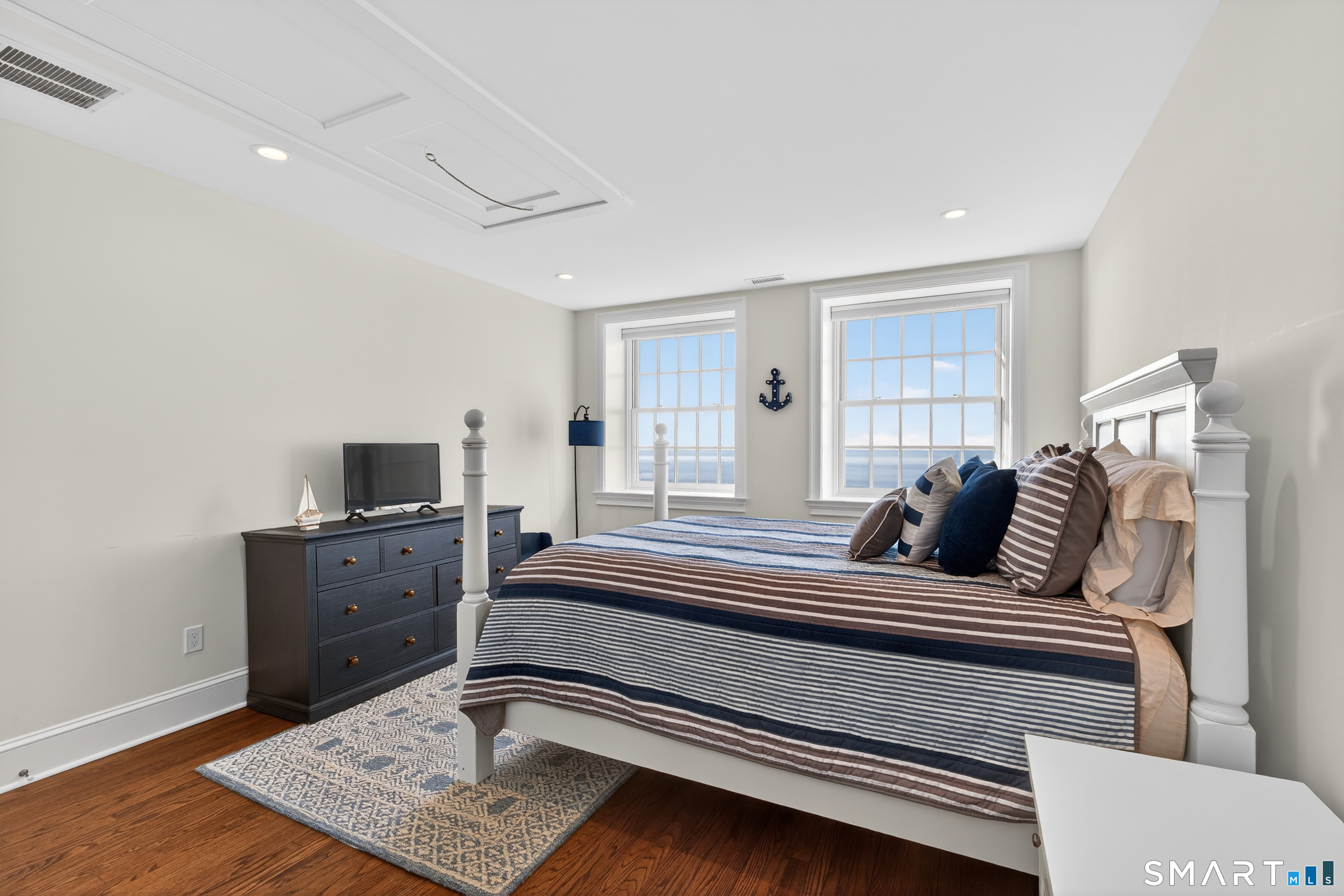 39 Vineyard Place Guilford, CT 06437 - Photo 23 of 41 a bedroom with a bed and furniture