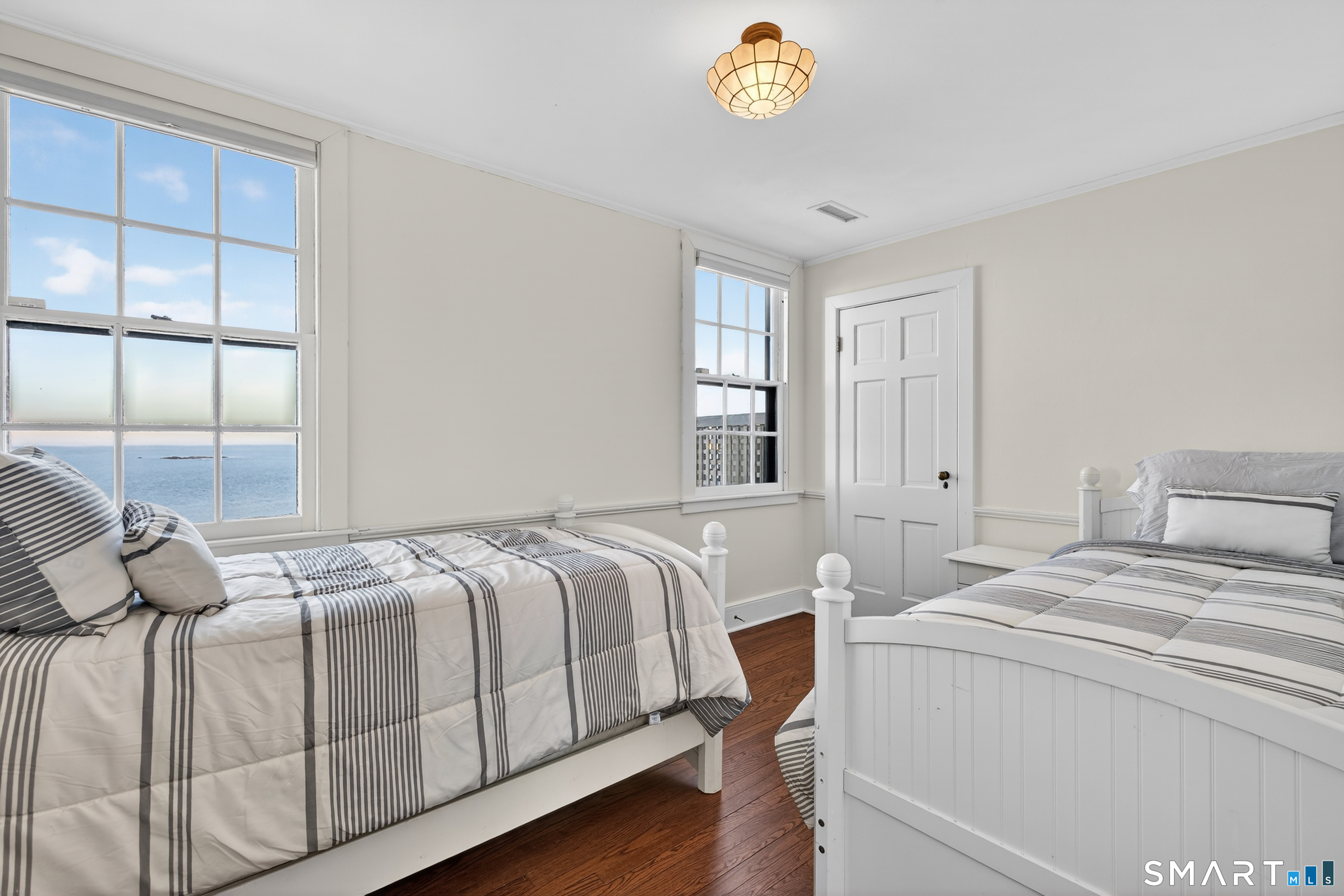 39 Vineyard Place Guilford, CT 06437 - Photo 28 of 41 a bedroom with a bed and a window