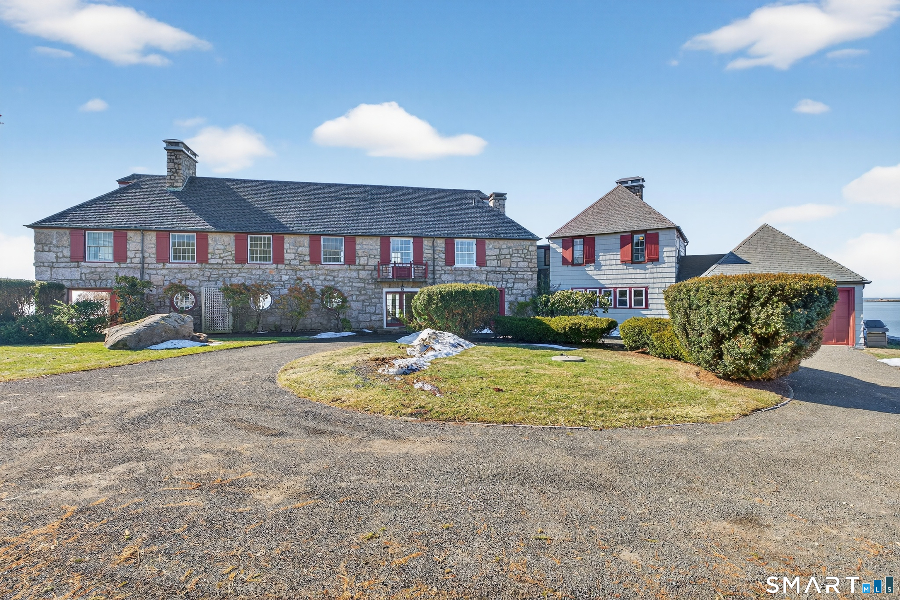 39 Vineyard Place Guilford, CT 06437 - Photo 3 of 41 a view of a big house with a yard and large tree