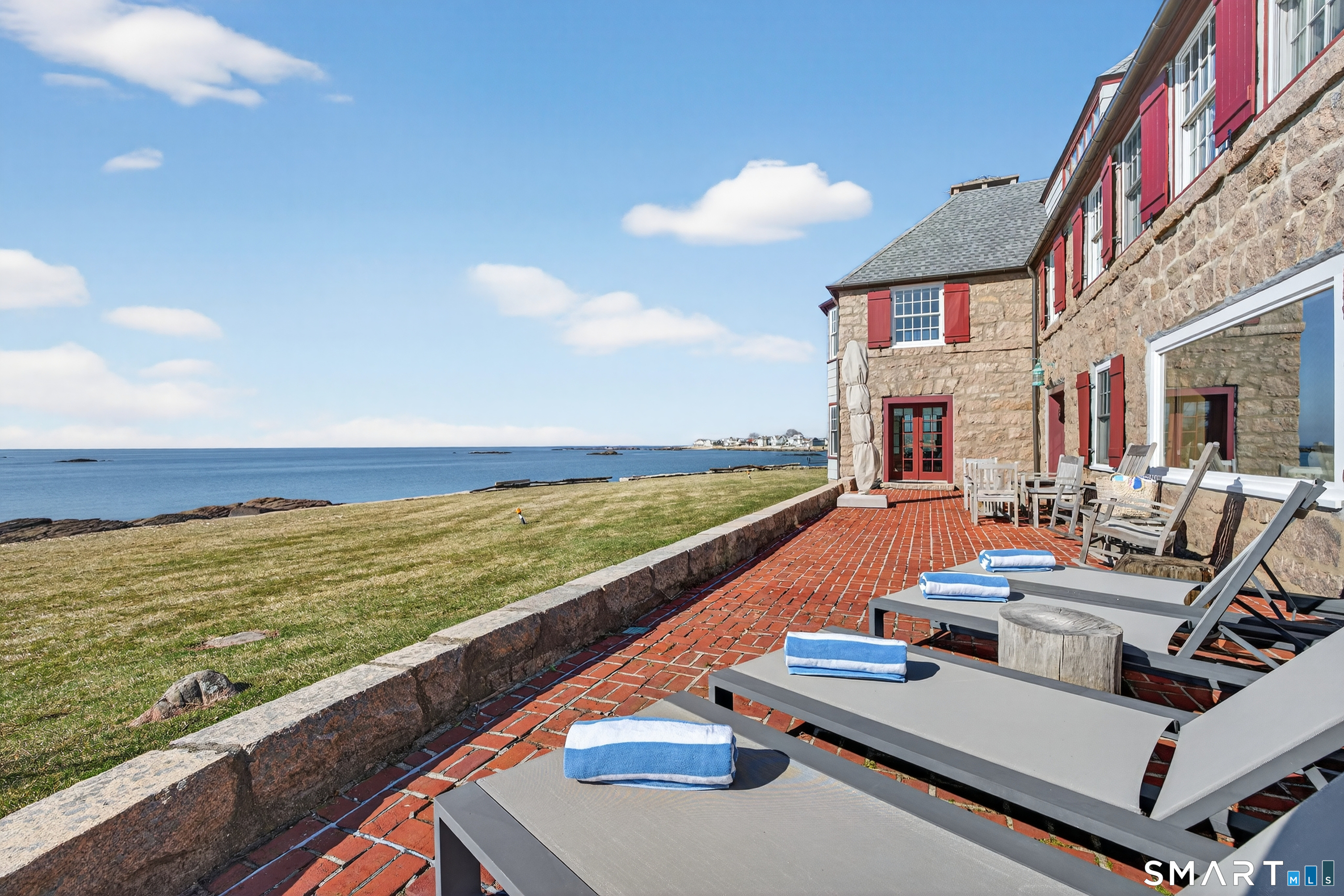 39 Vineyard Place Guilford, CT 06437 - Photo 33 of 41 a view of an ocean from a balcony