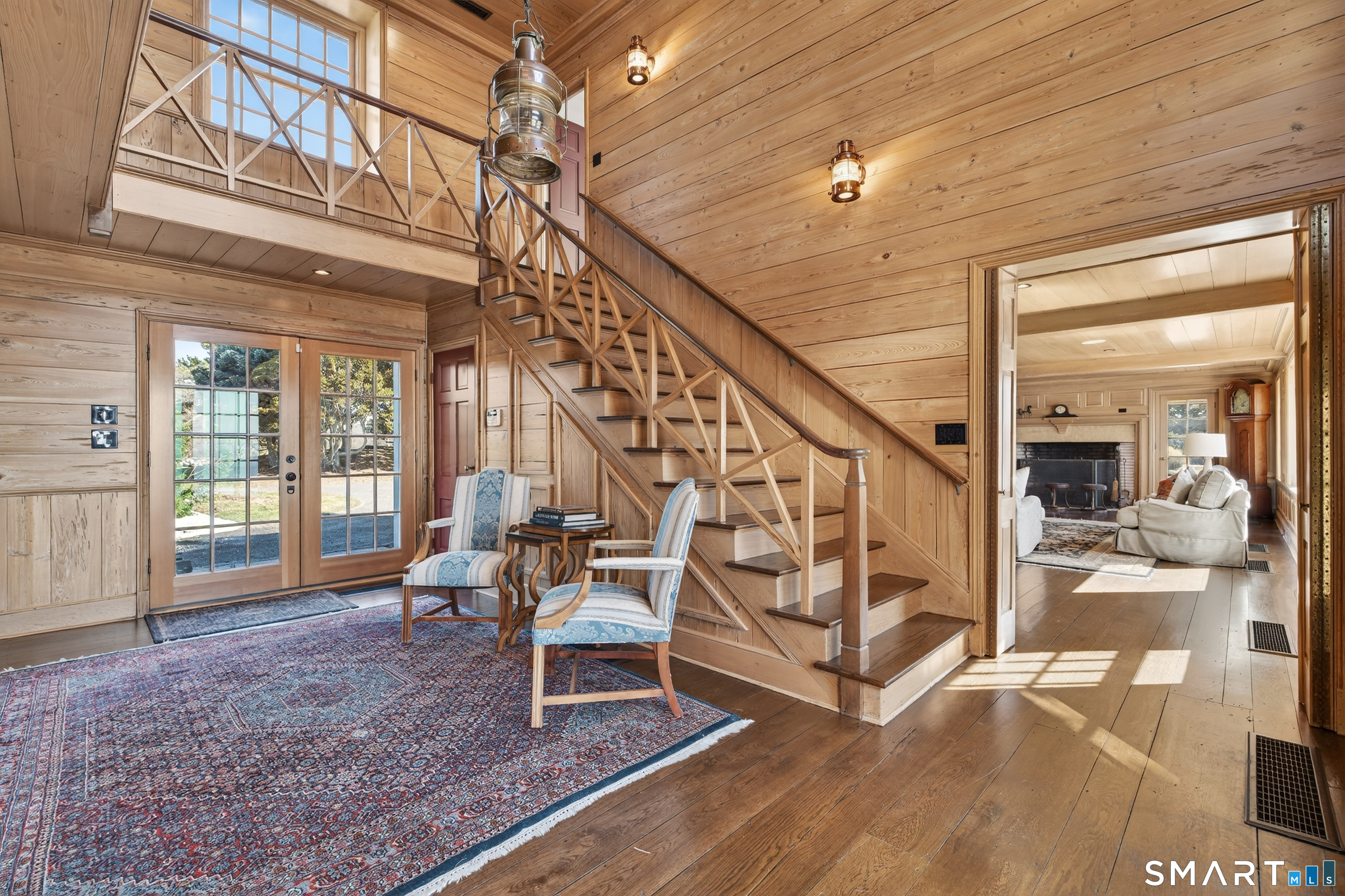 39 Vineyard Place Guilford, CT 06437 - Photo 6 of 41 a living room with wooden floor and furniture
