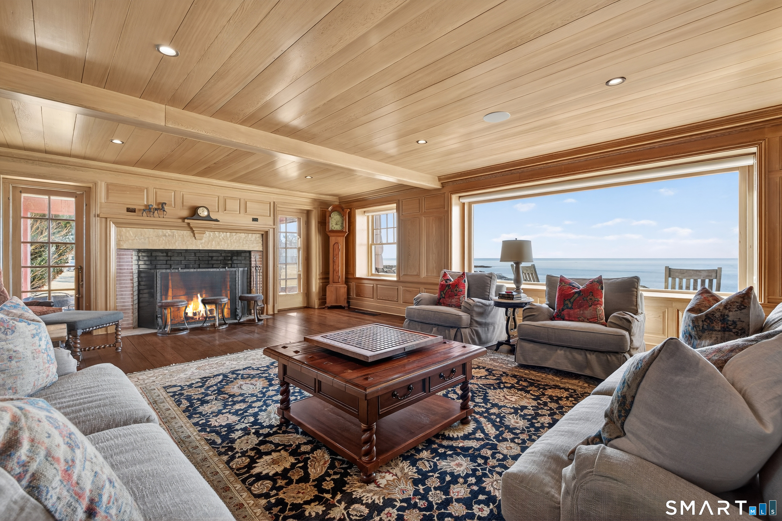 39 Vineyard Place Guilford, CT 06437 - Photo 7 of 41 a living room with furniture and a fireplace