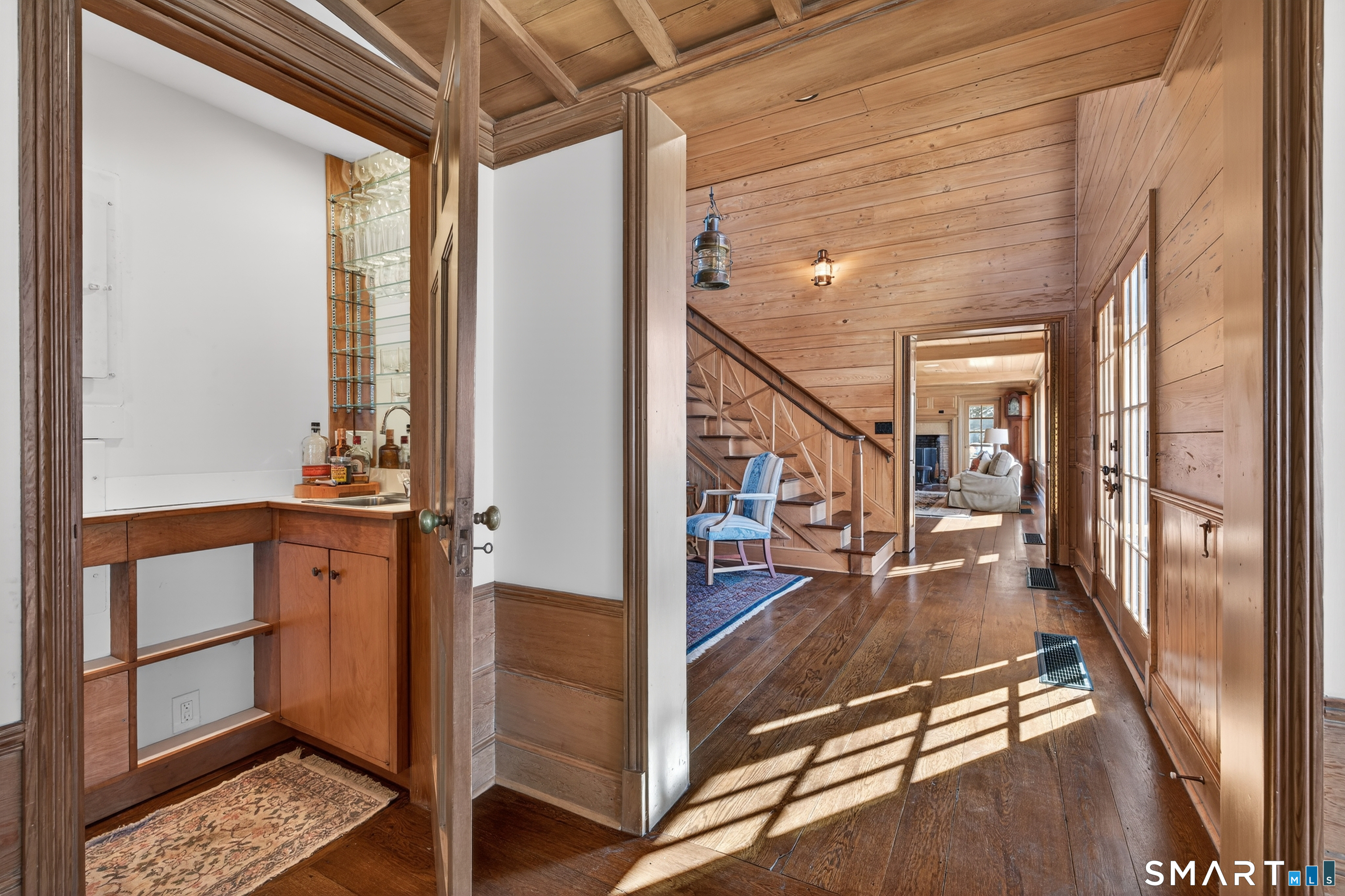 39 Vineyard Place Guilford, CT 06437 - Photo 10 of 41 a view of a hallway with wooden floor and staircase