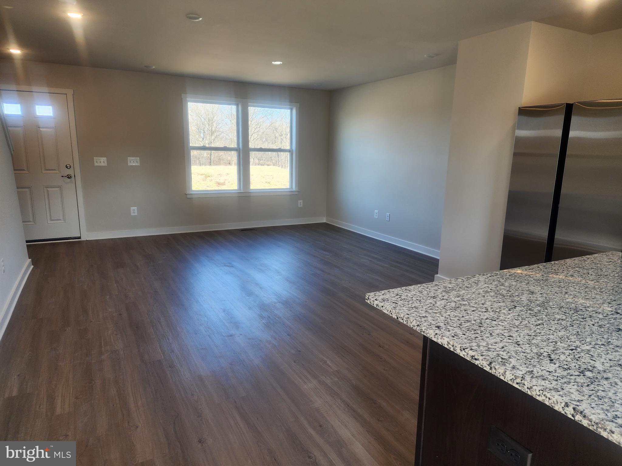 111 Quillworth Road Inwood, WV 25428 - Photo 4 of 19 an empty room with wooden floor