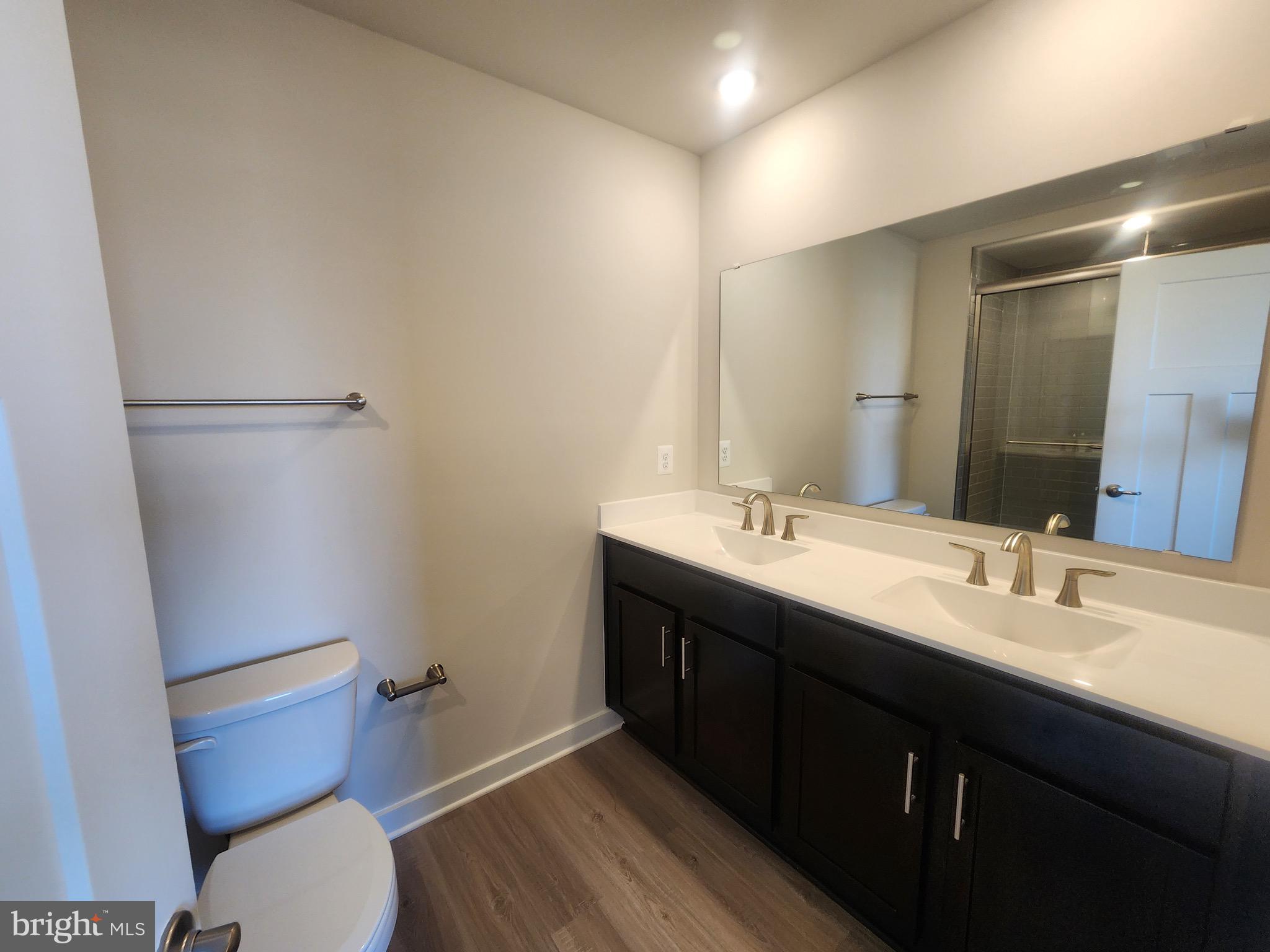 111 Quillworth Road Inwood, WV 25428 - Photo 8 of 19 a bathroom with a double vanity sink mirror and toilet