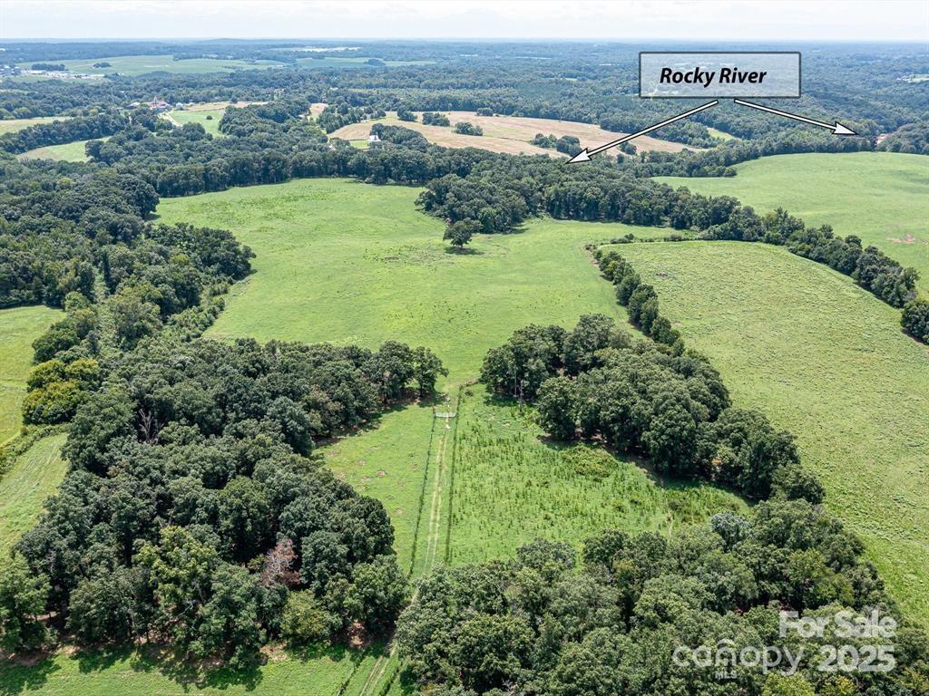 Tract B Rock Hole Road Stanfield, NC 28163 - Photo 11 of 23 an aerial view of a houses with a yard and lake view