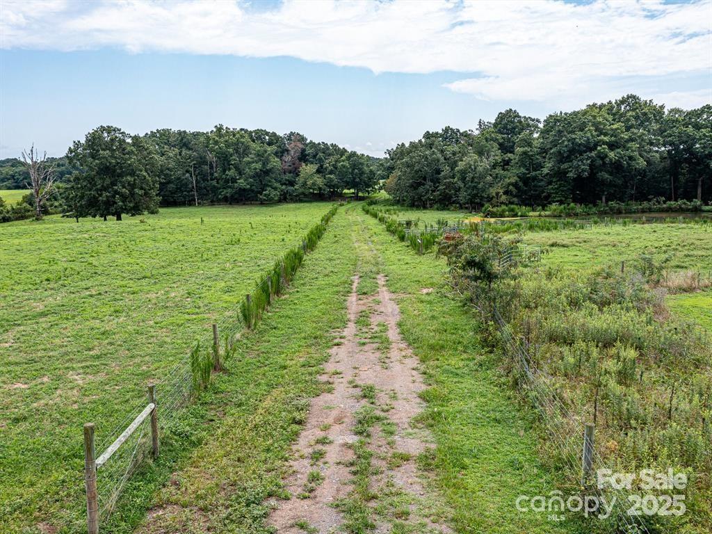 Tract B Rock Hole Road Stanfield, NC 28163 - Photo 2 of 23 a view of a lake with a big yard