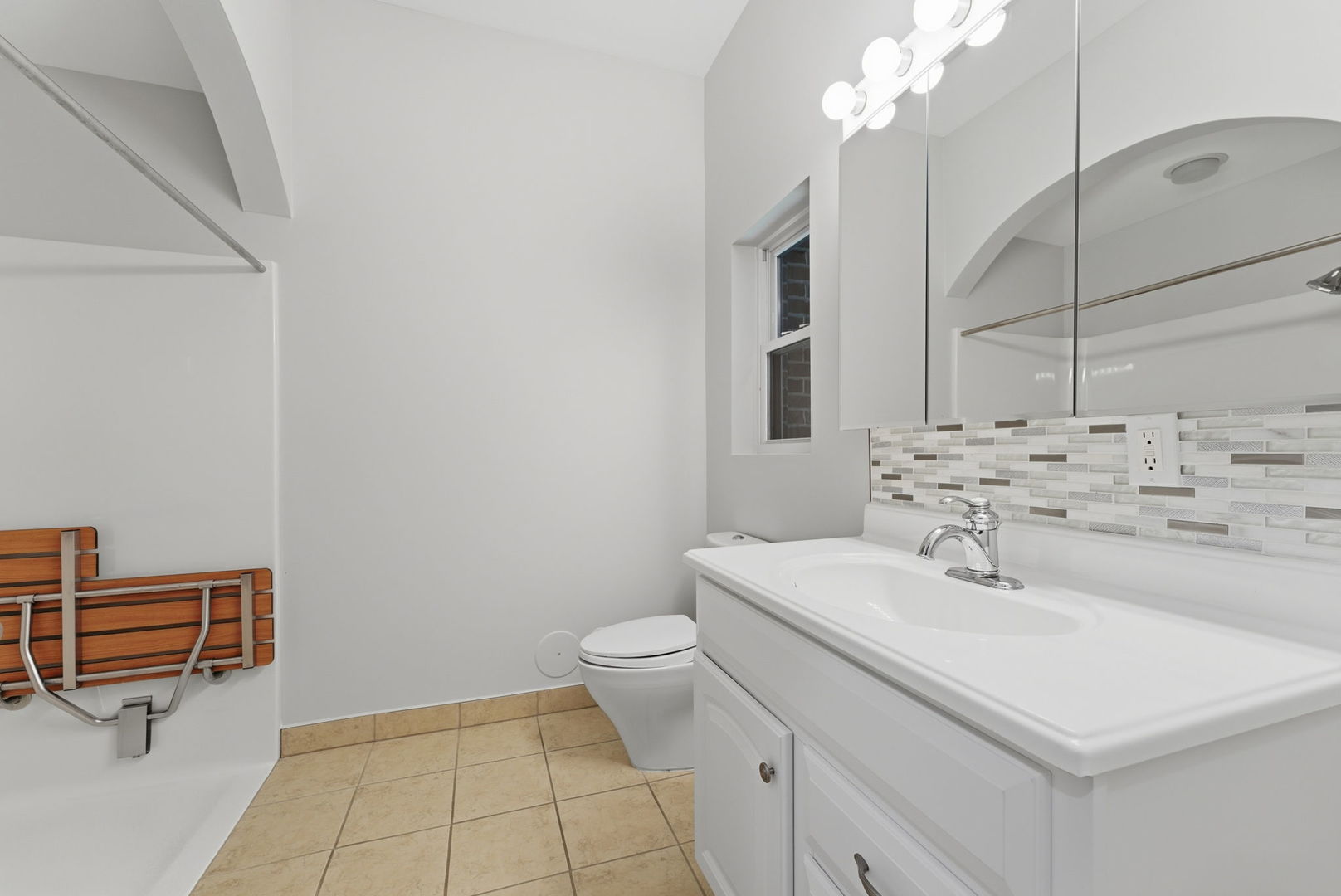 1002 2nd St Court Moline, IL 61265 - Photo 23 of 31 a bathroom with a sink a toilet and a mirror