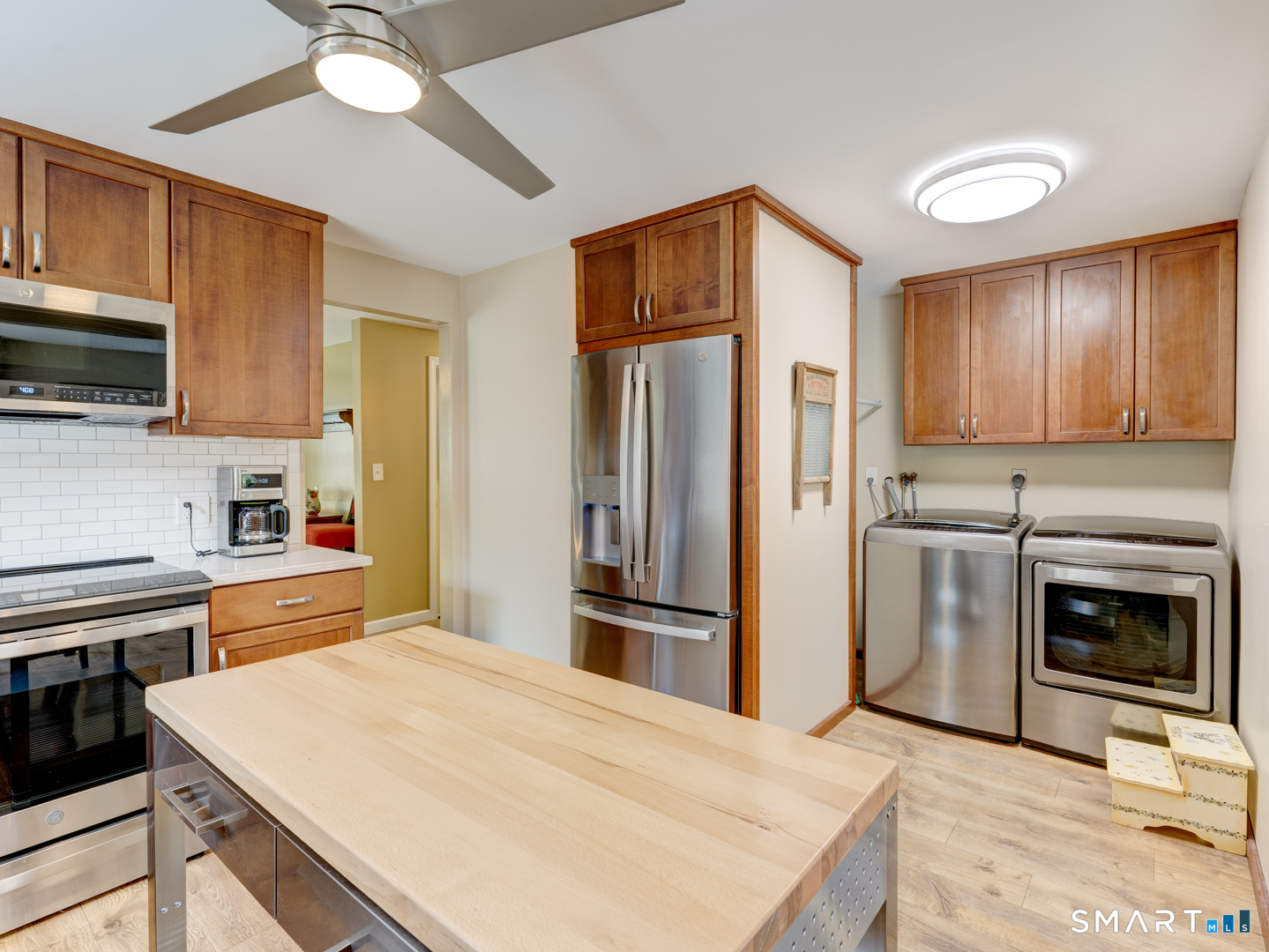 97 Lair Road New Hartford, CT 06057 - Photo 18 of 39 a kitchen with stainless steel appliances granite countertop a refrigerator oven a stove top oven a sink and dishwasher