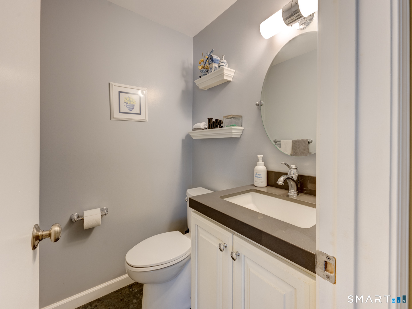 97 Lair Road New Hartford, CT 06057 - Photo 22 of 39 a bathroom with a granite countertop toilet sink and mirror