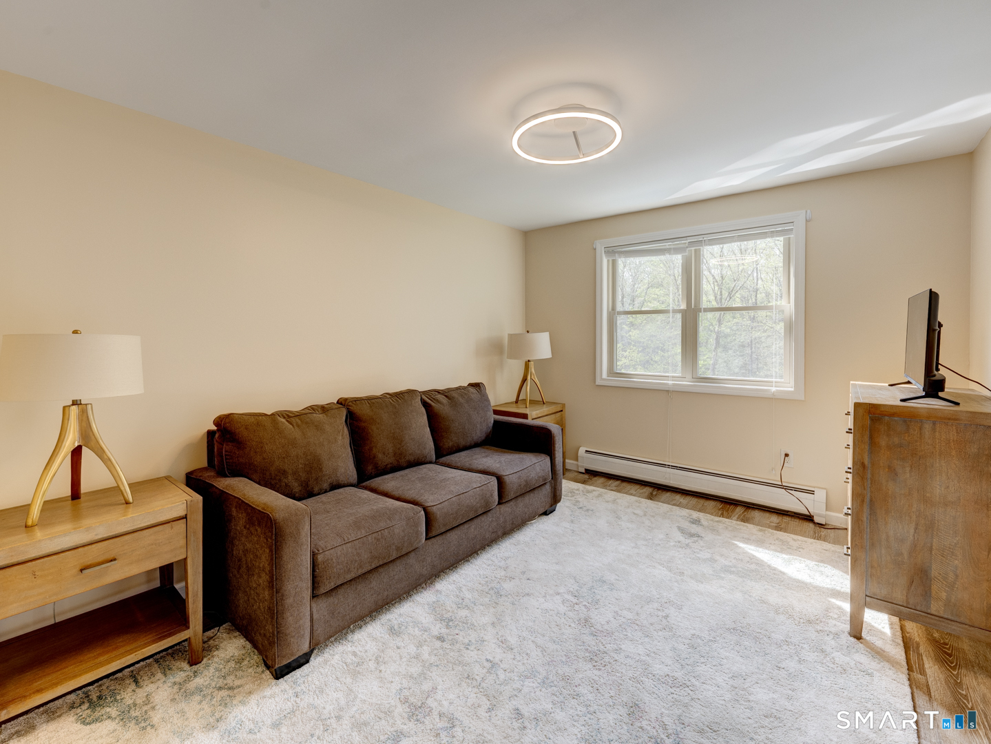 97 Lair Road New Hartford, CT 06057 - Photo 28 of 39 a living room with furniture and a window