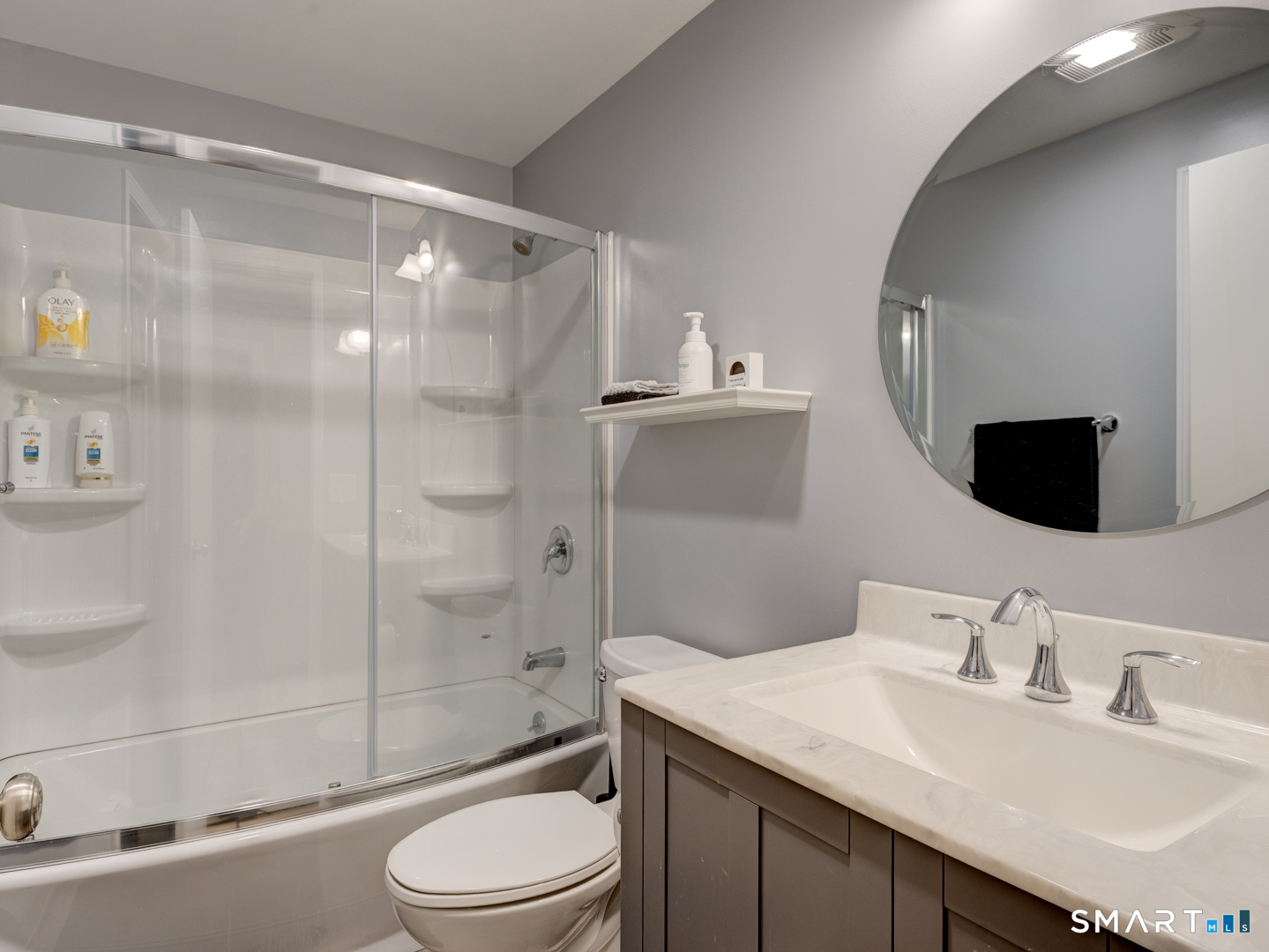 97 Lair Road New Hartford, CT 06057 - Photo 31 of 39 a bathroom with a sink toilet vanity and shower