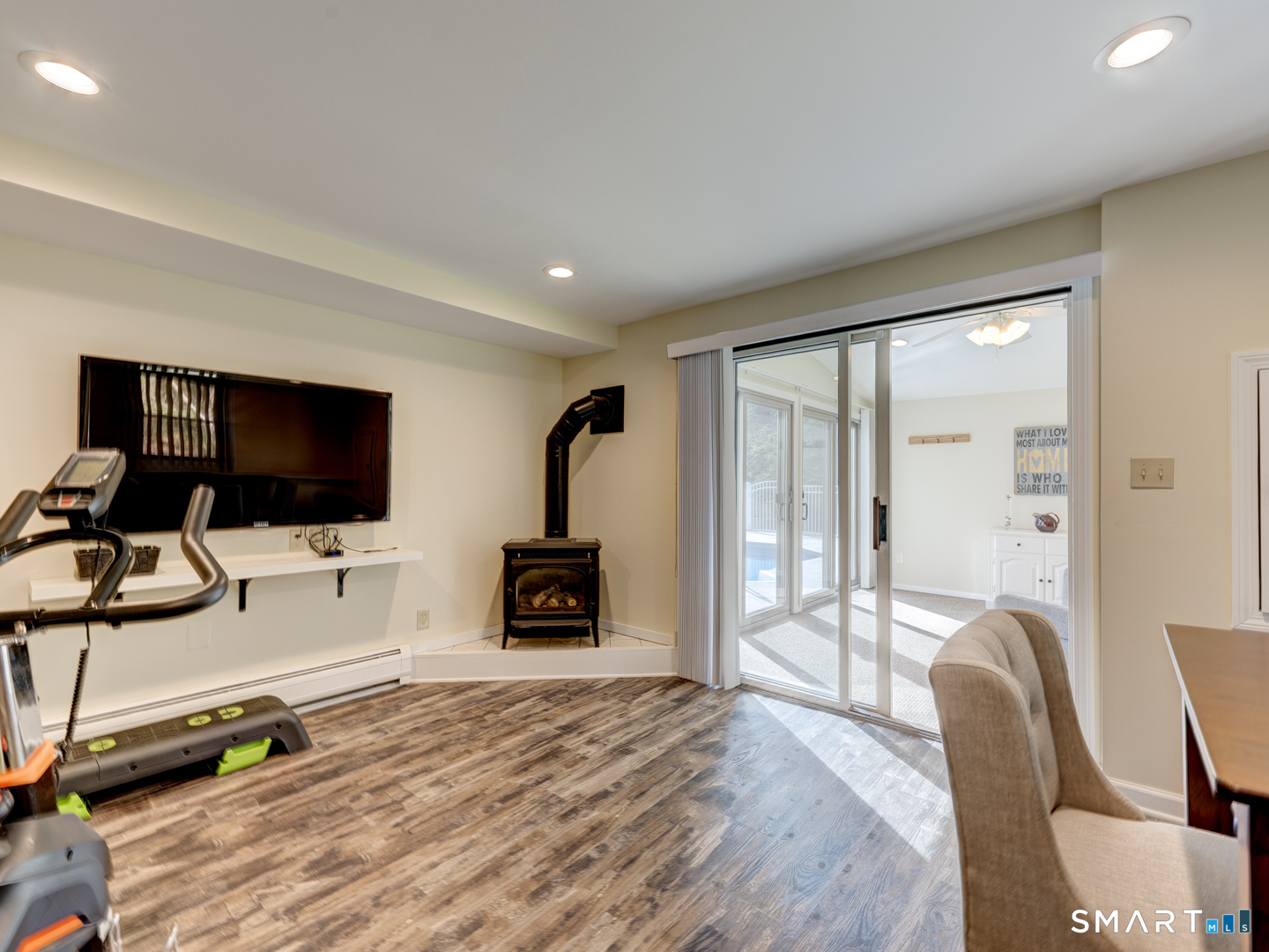 97 Lair Road New Hartford, CT 06057 - Photo 32 of 39 a living room with furniture and a flat screen tv