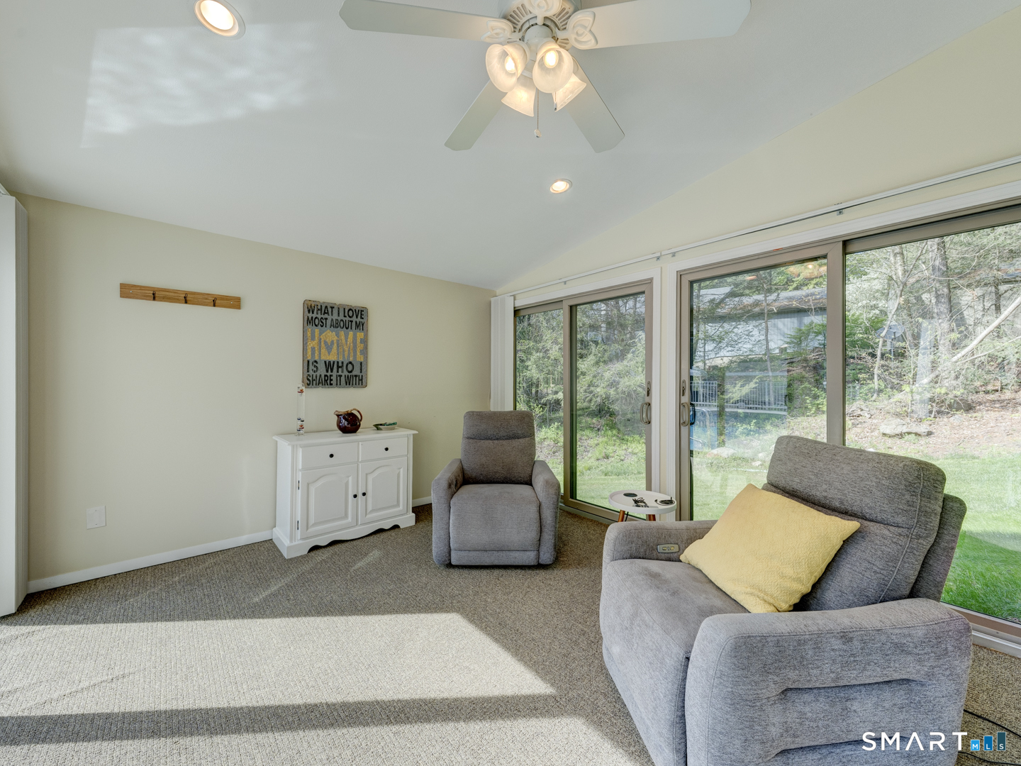 97 Lair Road New Hartford, CT 06057 - Photo 34 of 39 a living room with furniture and large windows