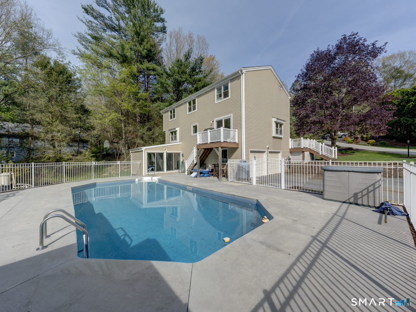 97 Lair Road New Hartford, CT 06057 - Photo 7 of 39 a view of a swimming pool with a patio