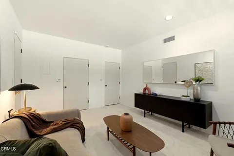 a room with furniture and a chair