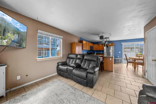 a living room with furniture and a window