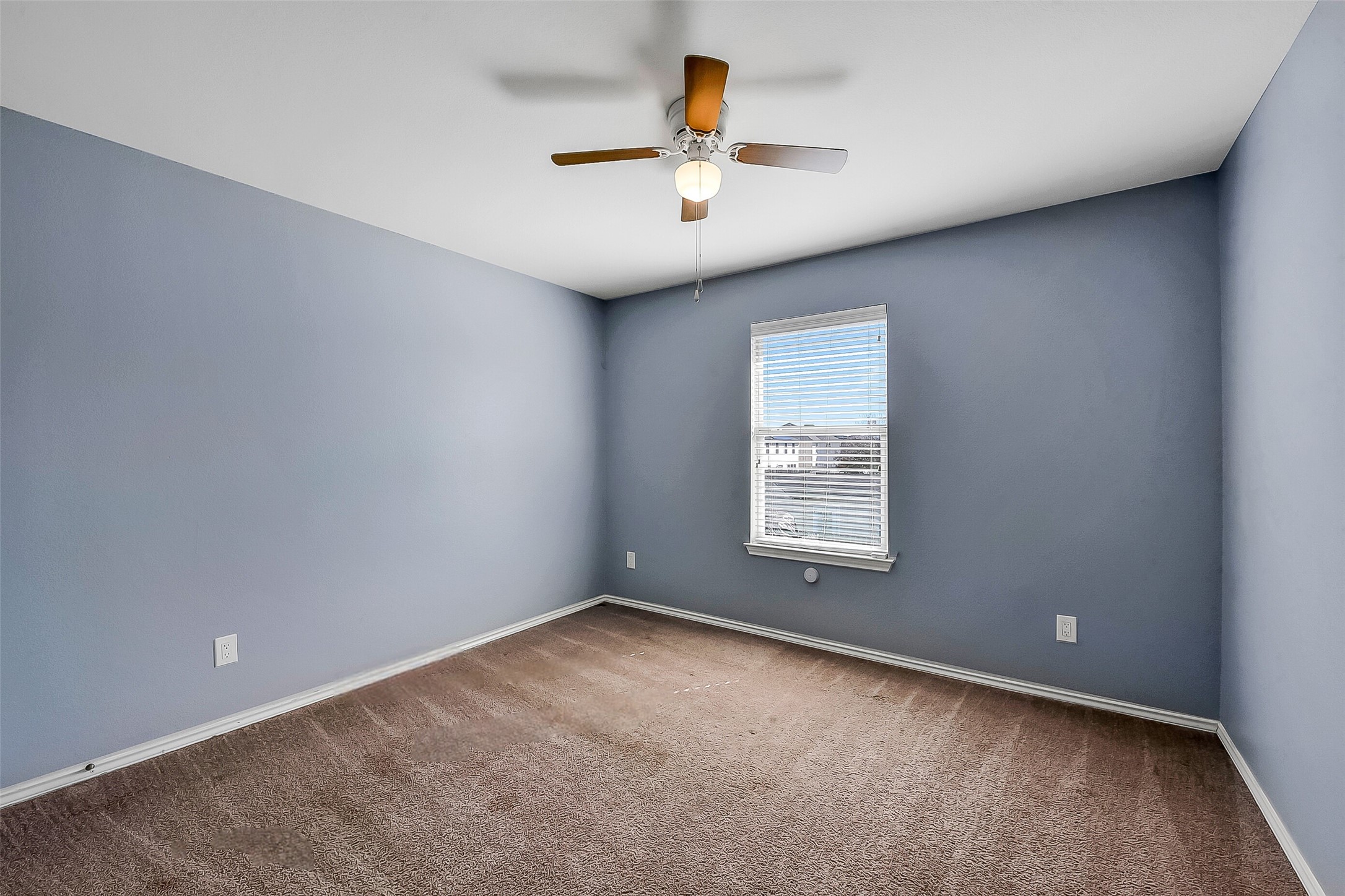 20011 Spring Wreath Lane Cypress, TX 77433 - Photo 30 of 39 an empty room with a window and a ceiling fan