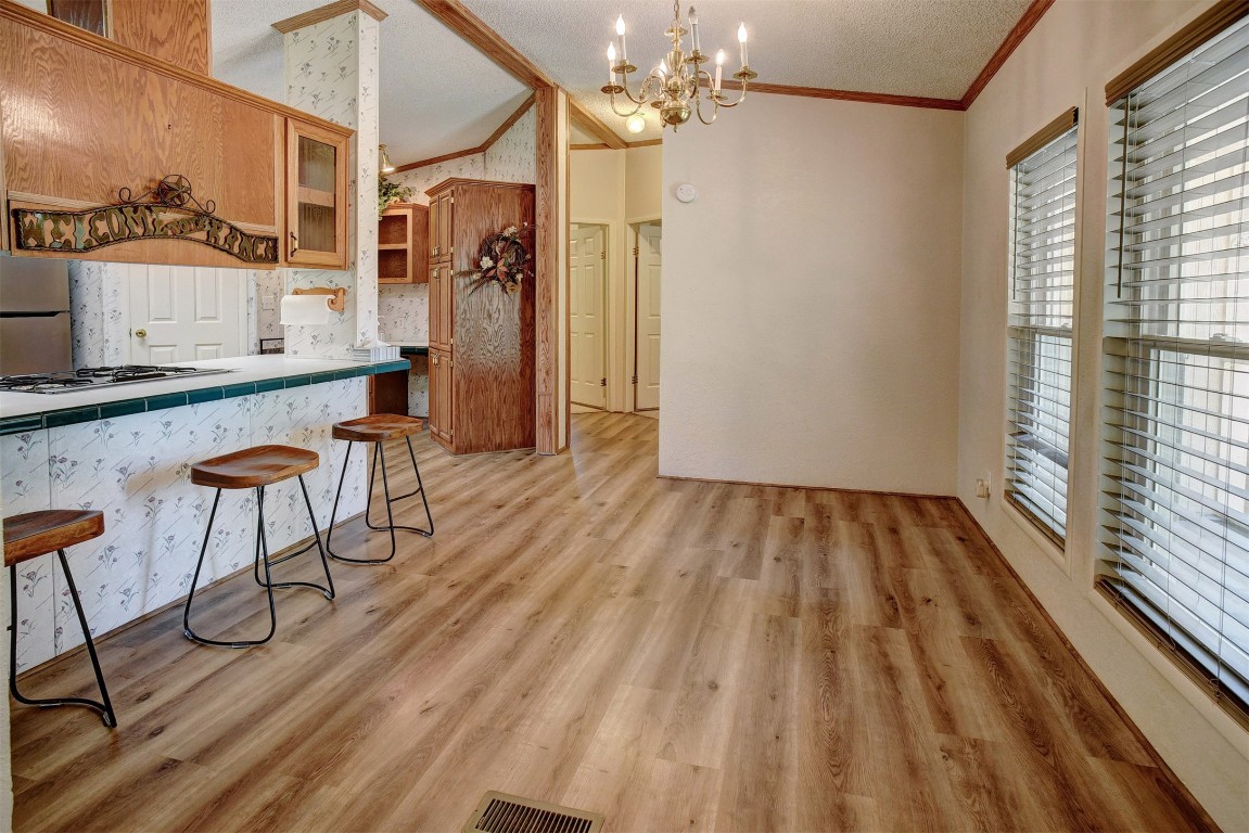 243 Piney Ridge Drive Bastrop, TX 78602 - Photo 16 of 40 a view of dining room with furniture window and wooden floor