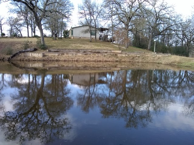 243 Piney Ridge Drive Bastrop, TX 78602 - Photo 32 of 40 a view of yard covered with snow in outdoor space
