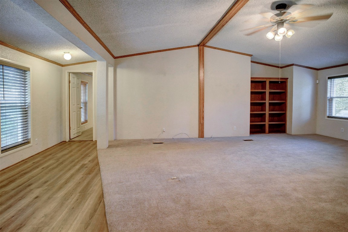 243 Piney Ridge Drive Bastrop, TX 78602 - Photo 9 of 40 a view of an empty room with a ceiling fan and window