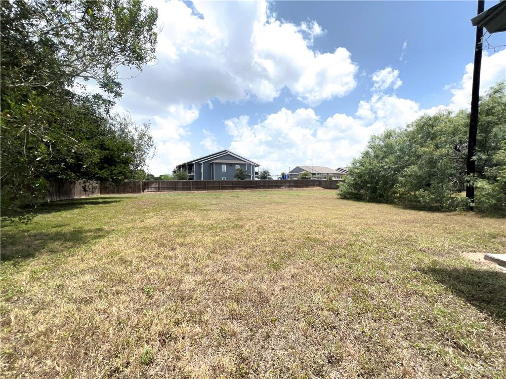 218 East Colorado Street Rio Hondo, TX 78583 - Photo 15 of 18 a view of a lake with houses in the back