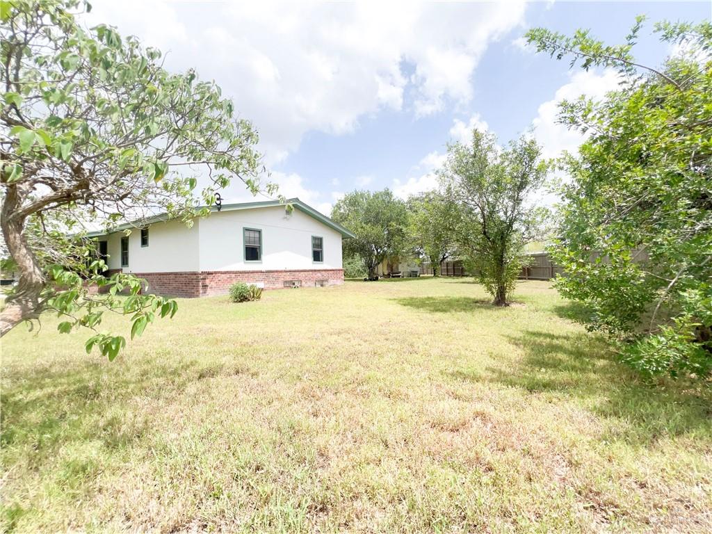 218 East Colorado Street Rio Hondo, TX 78583 - Photo 17 of 18 a bathroom with a sink and a yard