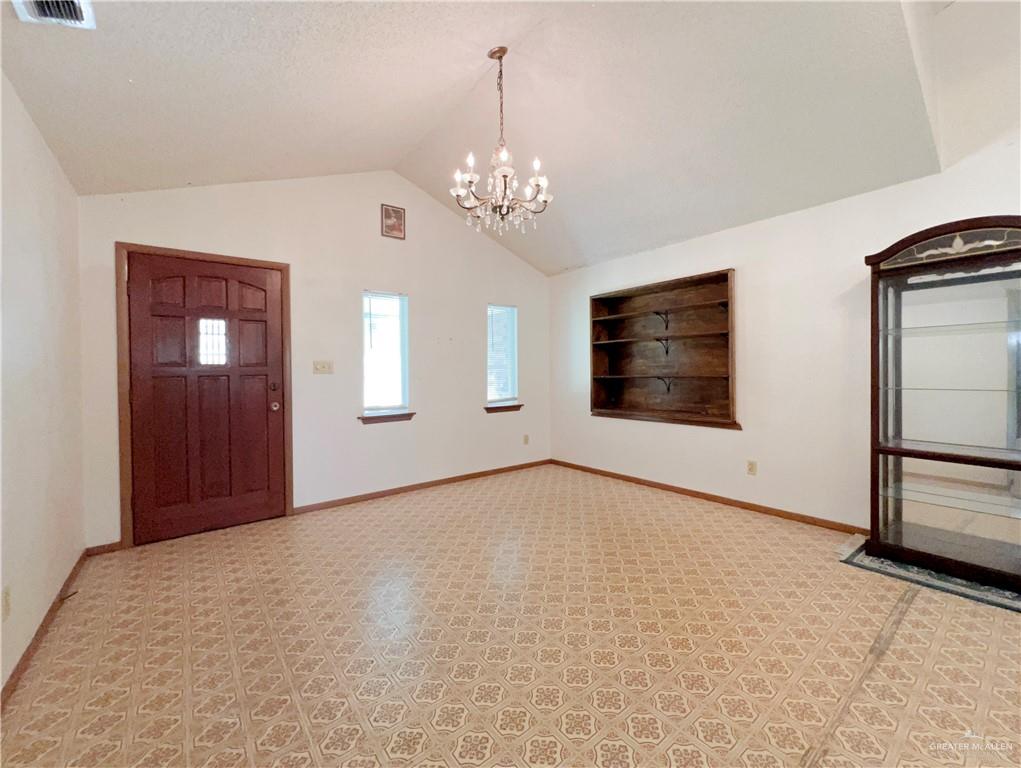 218 East Colorado Street Rio Hondo, TX 78583 - Photo 3 of 18 a view of an empty room with a window