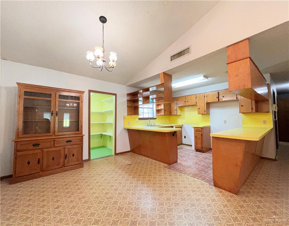 218 East Colorado Street Rio Hondo, TX 78583 - Photo 4 of 18 a large kitchen with stainless steel appliances granite countertop a stove and a refrigerator