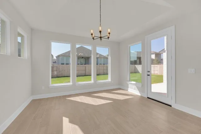 a spacious bathroom with a double vanity sink mirror and bathtub