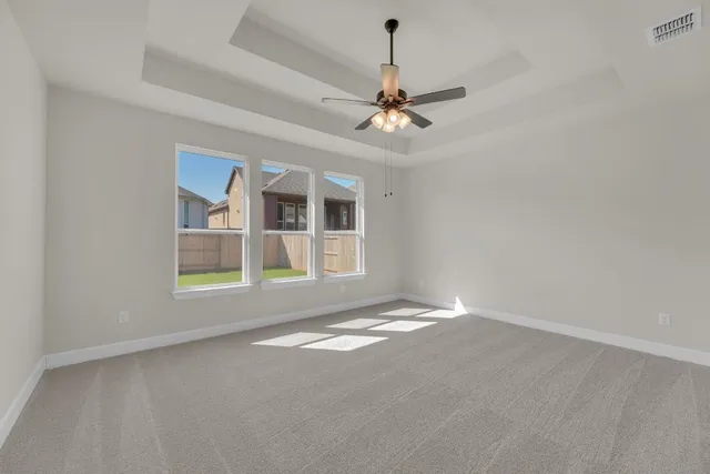 a bathroom with a tub sink shower and mirror