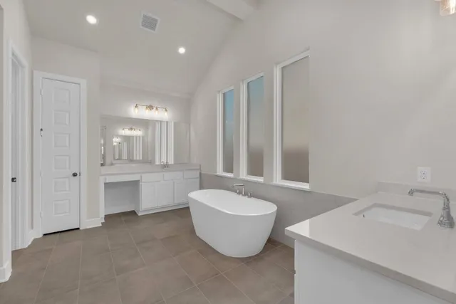 a bathroom with a shower and a glass door