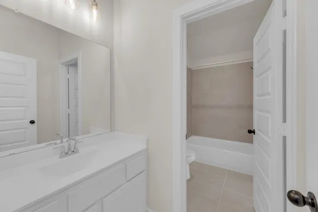 front view of a house with a garden