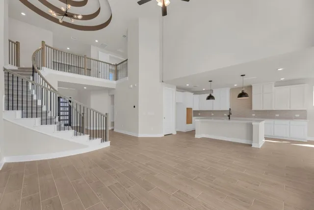 a view of a living room and kitchen with furniture