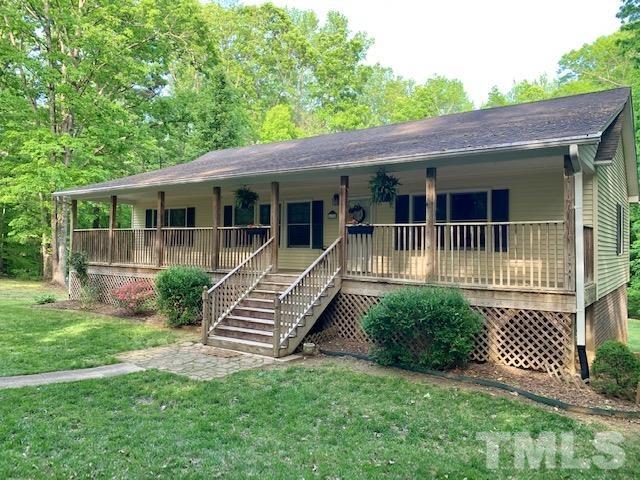 4154 Culbreth Road Stem, NC 27581 - Photo 1 of 19 a front view of a house with a yard