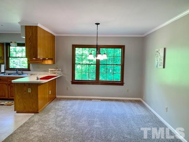 4154 Culbreth Road Stem, NC 27581 - Photo 11 of 19 a kitchen with a sink cabinets and window