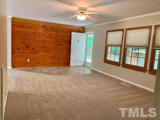 4154 Culbreth Road Stem, NC 27581 - Photo 4 of 19 en empty room with windows and ceiling fan