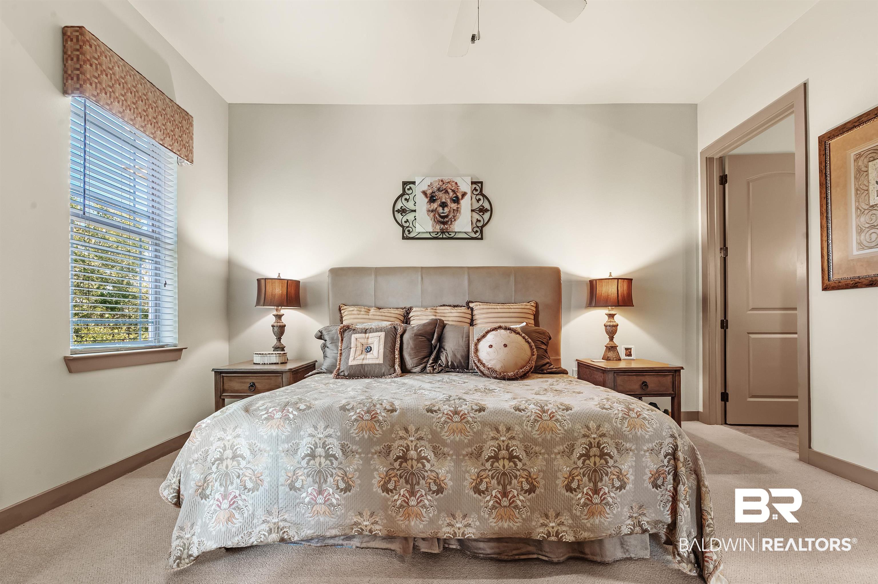 1430 Regency Road, Unit A301 Gulf Shores, AL 36542 - Photo 20 of 47 Carpeted bedroom featuring ceiling fan