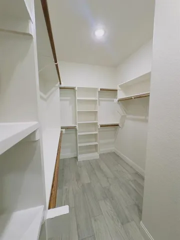 a bathroom with a shower and toilet