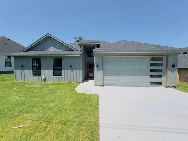 a front view of a house with yard