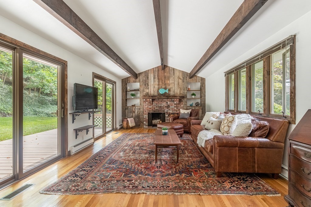 14 Driftwood Road Marblehead, MA 01945 - Photo 12 of 30 a living room with furniture a large window and a fireplace